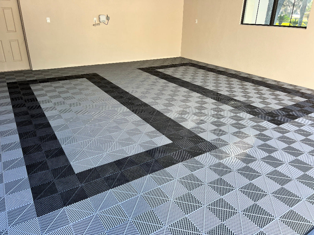 Room with geometric patterned floor tiles on a plain wall background