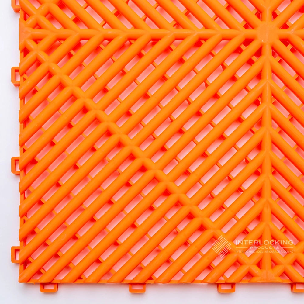Orange interlocking plastic tile on a white background