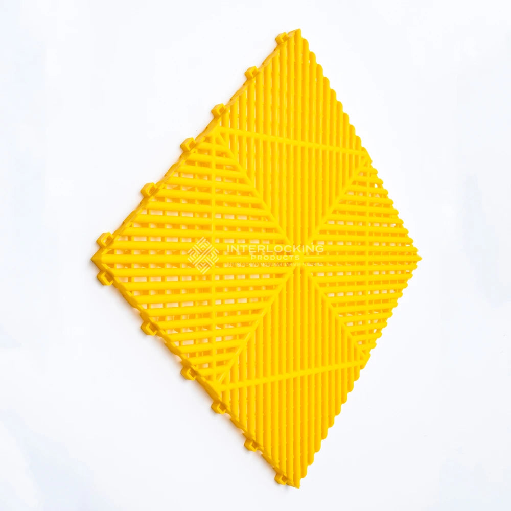 Yellow interlocking foam puzzle piece on a white background